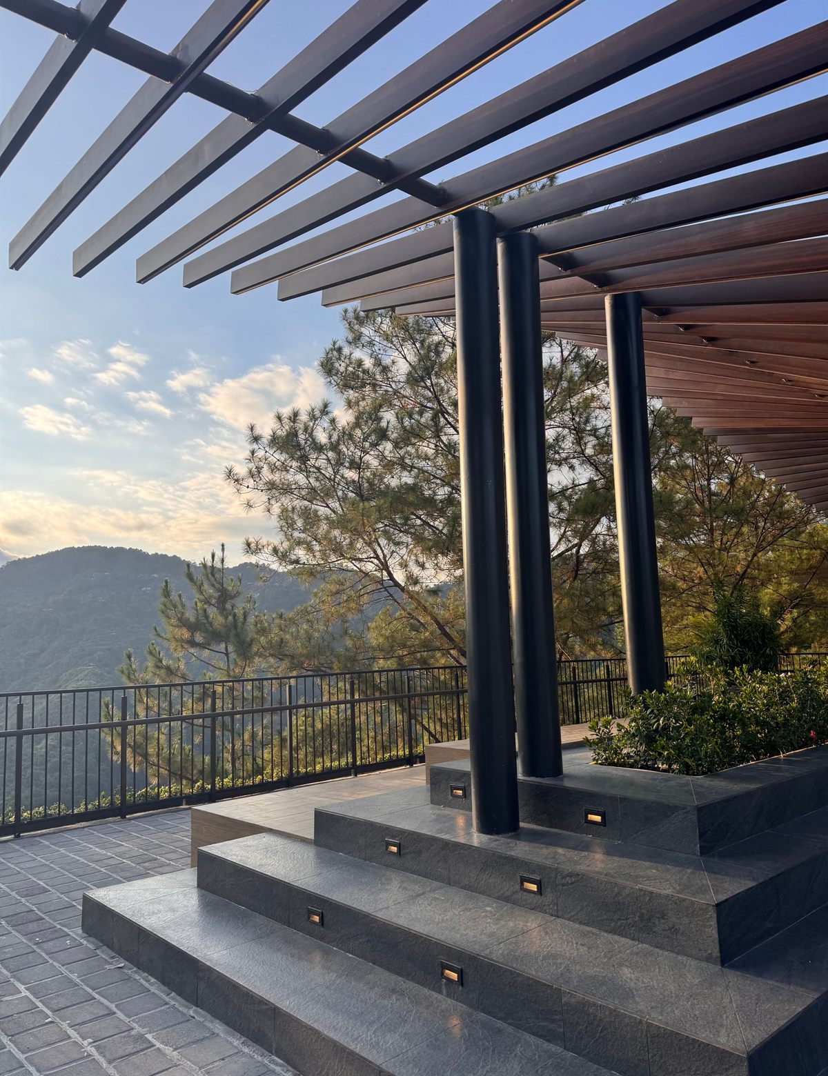 Outdoor living area with pergola system